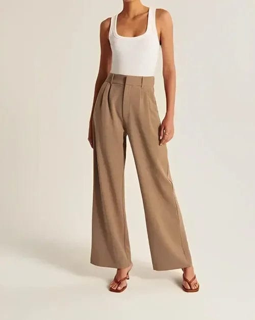 Kvinde iført lyse wide-leg bukser i høj talje, skræddersyet pasform, med cropped top og blazer._15