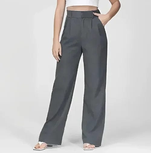 Kvinde iført lyse wide-leg bukser i høj talje, skræddersyet pasform, med cropped top og blazer._17